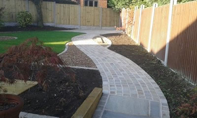 Garden designed and constructed near Normanton, including Fencing, turf, cobble path, flags and sleepers.